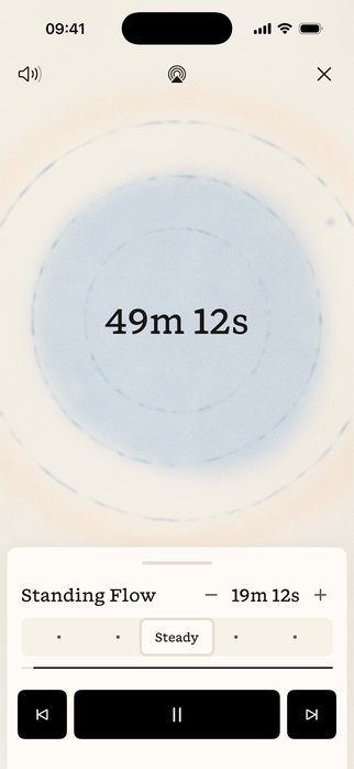 The Motif app during a class: a soft blue form breathing with the music, the time remaining, and the pace and phase controls